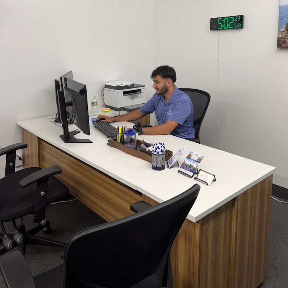 A team member at work at the front desk of the Sheikh Insurance office in Upper Darby, Pennsylvania